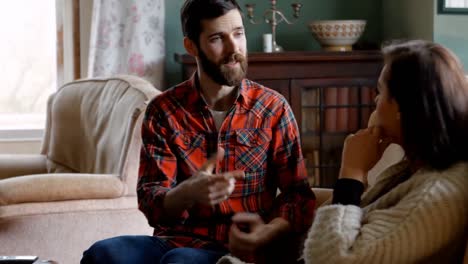 couple arguing each other in living room