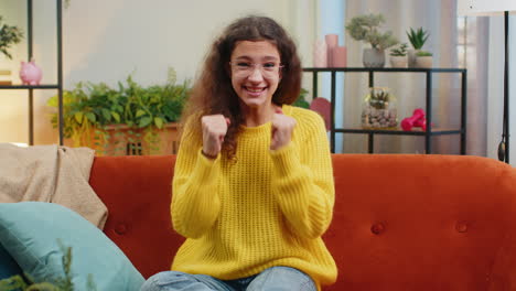 happy young woman giving thumbs up