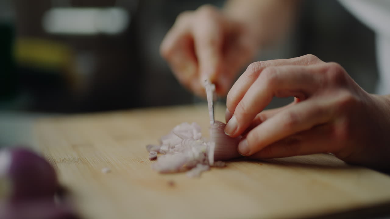 Cutting Onion On Wooden Board Into Small Cubes Chopping Onion