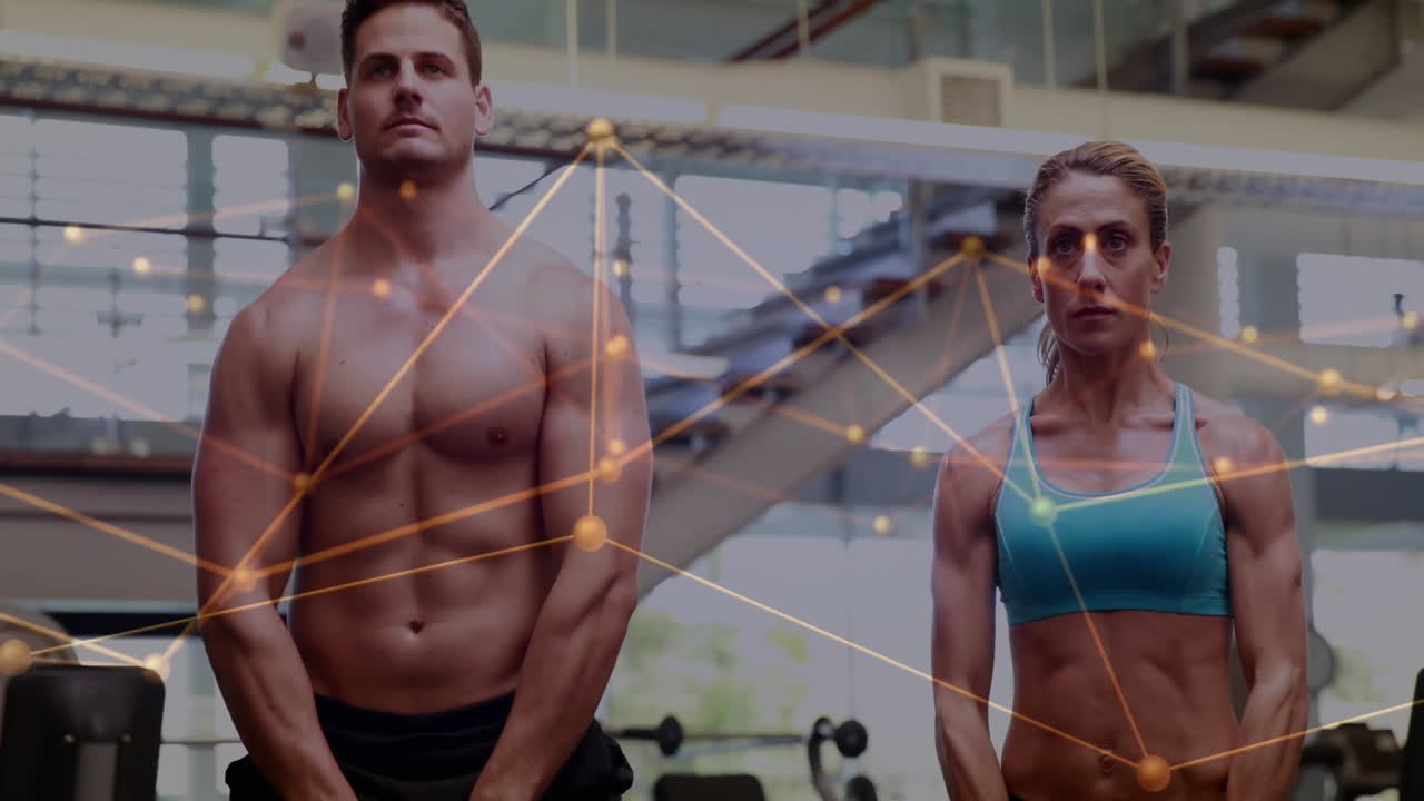 Fit man and athletic woman tracking fitness metrics in gym, with floating network graphics