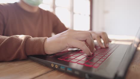 a close-up business man press to type information computer laptop for shopping online at home