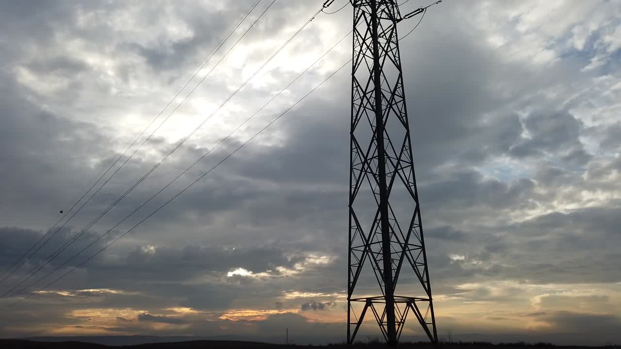 Electrical Transmisson Tower on the Beautiful Sunset