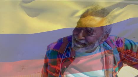 animación de la bandera de colombia sobre el hombre afroamericano mayor