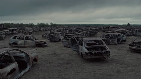 destroyed cars in a field