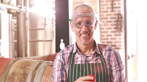 Brewery-worker-checking-the-product