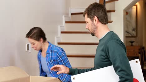 Couple-unpacking-boxes-in-their-new-home-4K-4k