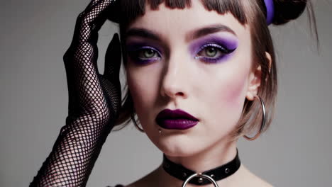 fashion portrait of a woman with bold makeup and accessories