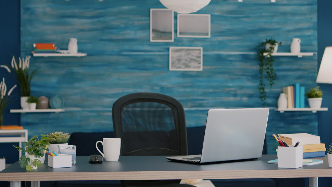 Bright modern living room with nobody in it with blue furniture and walls