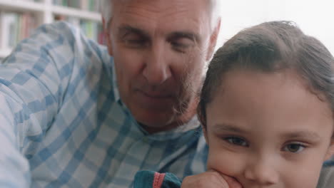grandfather and child having video chat little girl sharing vacation weekend with family grandpa enjoying chatting on mobile technology at home with grandaughter pov 4k