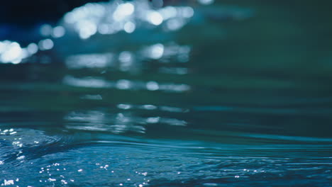 blue water with small waves and ripples in slow motion