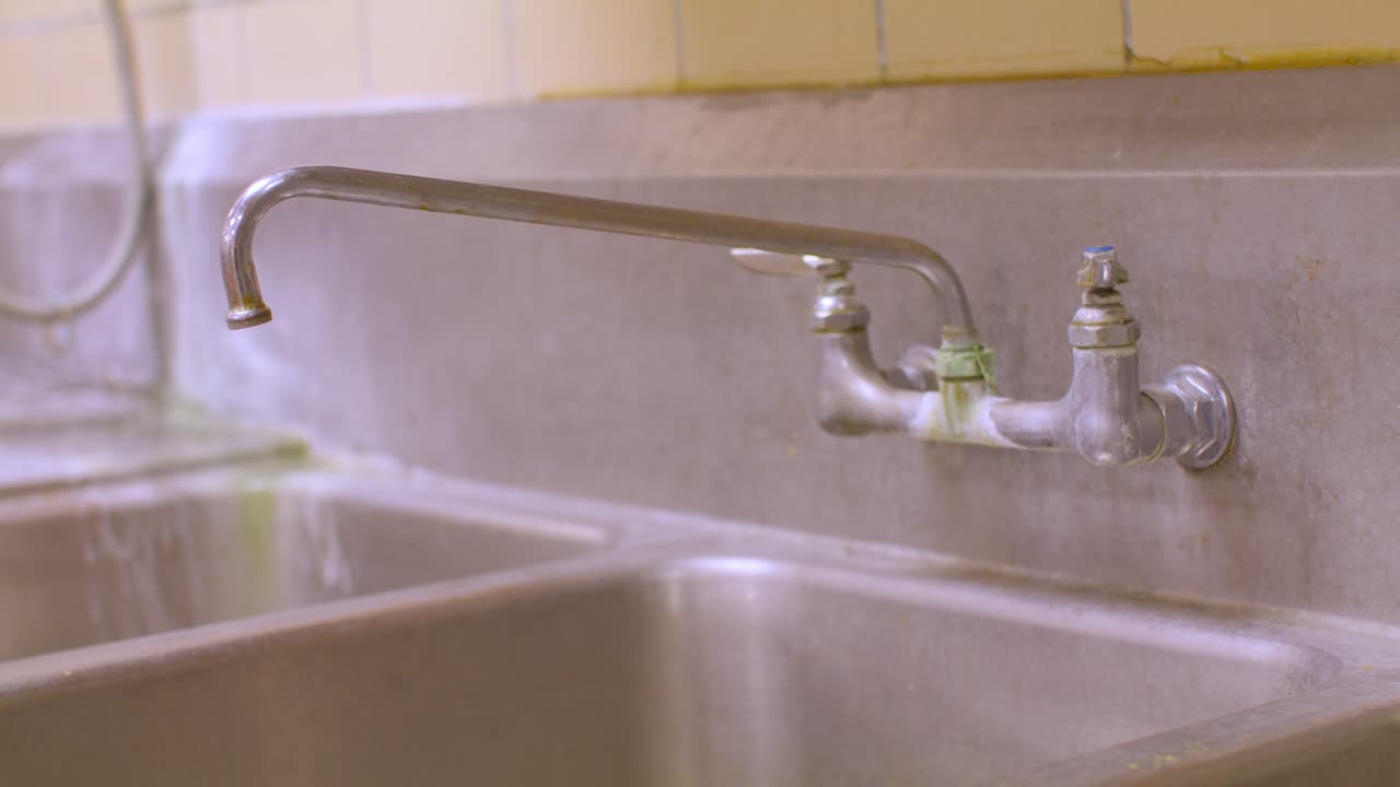 Close up of industrial sink with stable video shot.