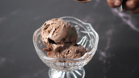 scooping chocolate ice cream