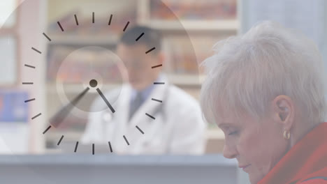 digital clock ticking against woman sitting in hospital