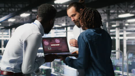 worried workers trying to fix hacked infrastructure systems