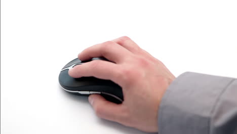 hand holding and moving a computer mouse