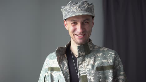 portrait of a man in military fatigues, face to camera