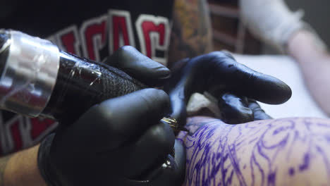 close-up of the process of tattooing a tiger