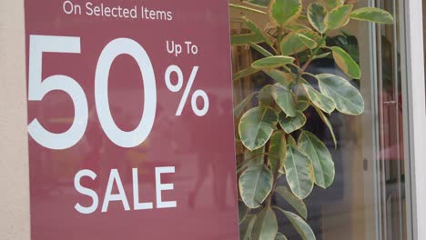 store front sale display with plant