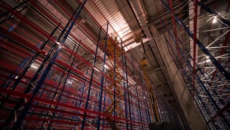 big and modern warehouse under construction, featuring metal shelving and other industrial equipment.