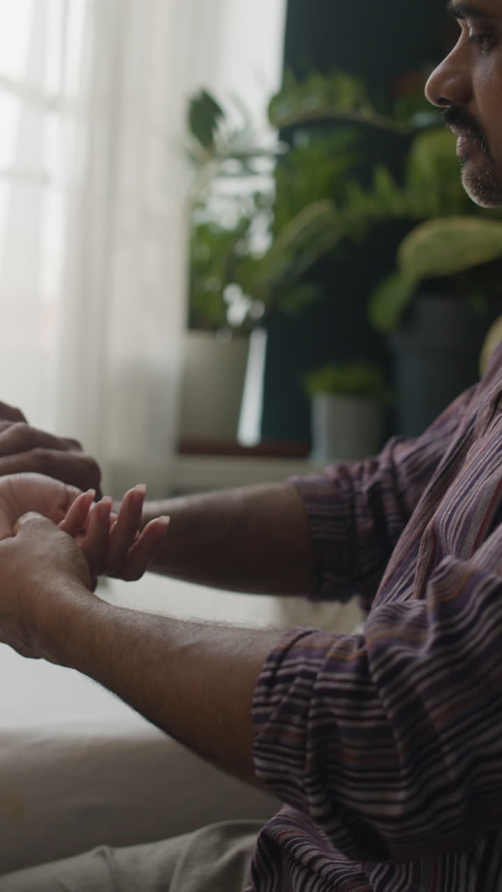 Hands resting indoors