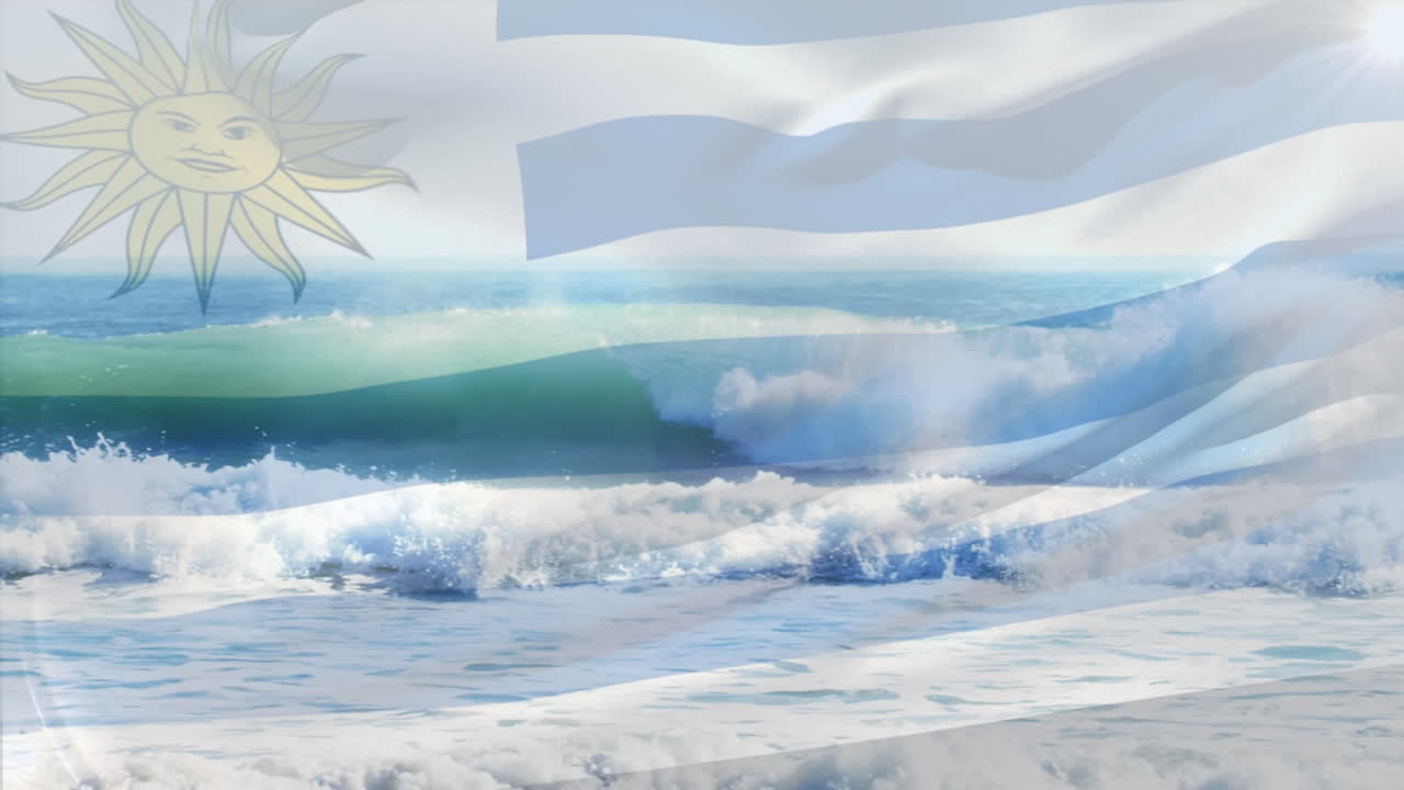 composición digital de la bandera uruguaya ondeando contra la vista aérea de las olas en el mar