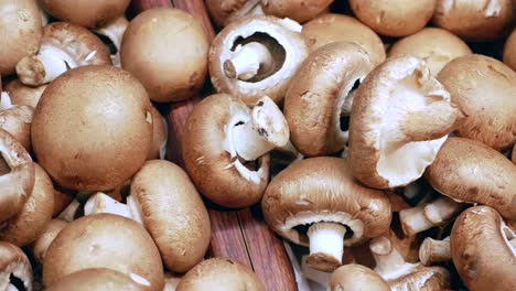 Fresh-mushrooms-in-wooden-bowl-,