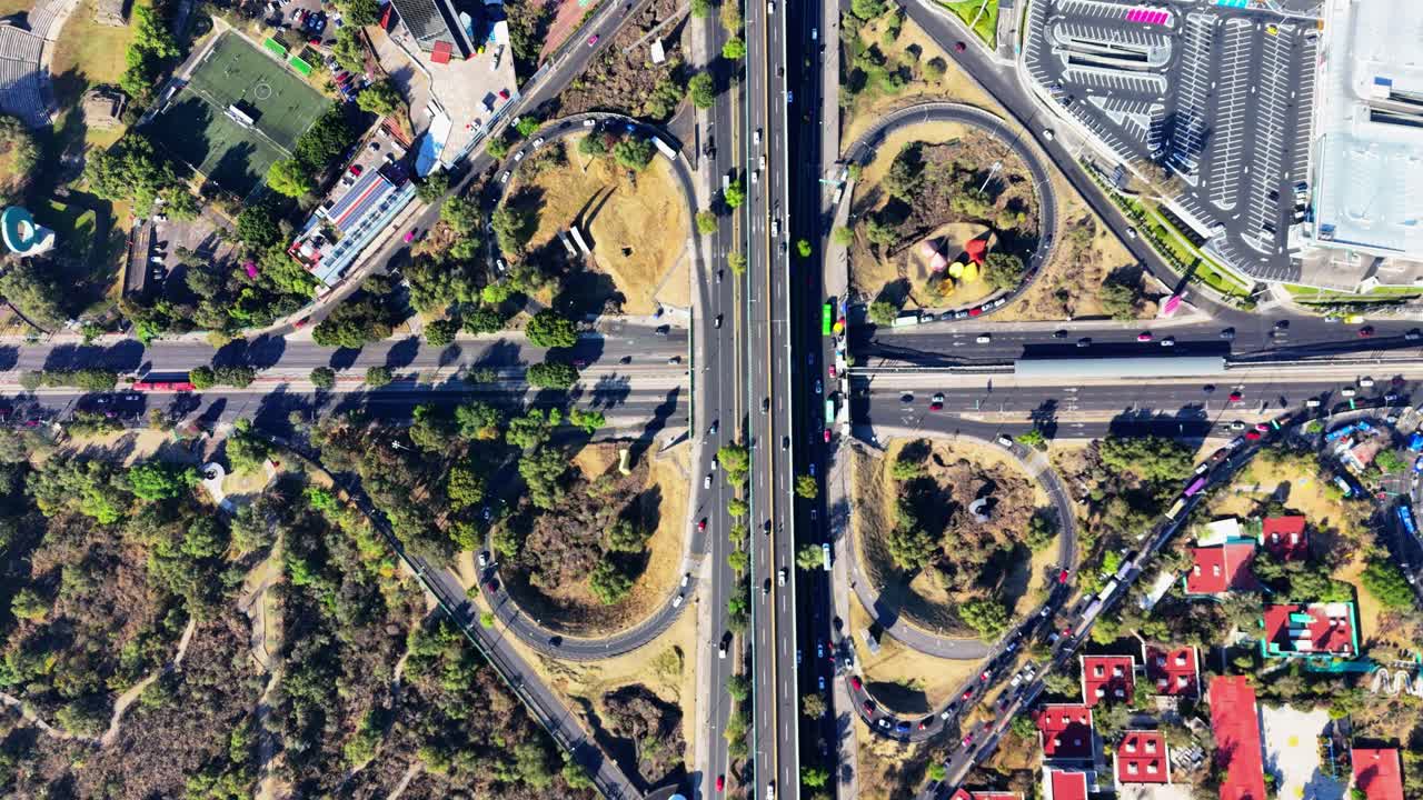 Aerial view in slow motion of Periferico and Insurgentes cloverleaf in southern Mexico City