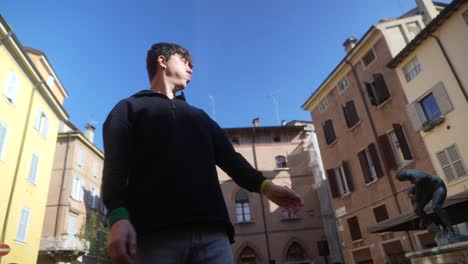 young man in an italian city square