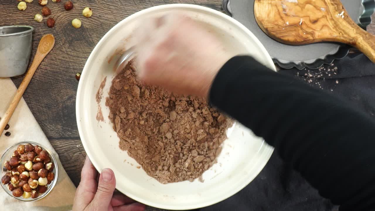 A delicious dessert, Coffee Hazelnut Cream Tart. Made with espresso powder, chocolate crust and loaded with crushed hazelnut. Adding milk or cream to the batter for the chocolate pie crust and mixing