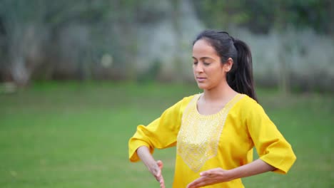 indian girl doing breathe in breathe out yoga exercise