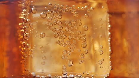 close up of ice cube in a soft drinks