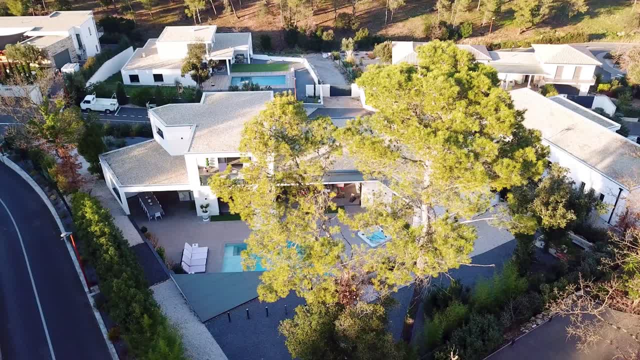 Aerial video sequence of luxurious and well stylish villa house with swimming pool at S&egrave;te city, south of France