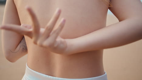 closeup naked woman back at summer beach. unrecognizable girl standing seashore