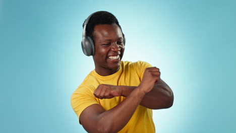 Happy-black-man,-headphones-and-dancing-to-music