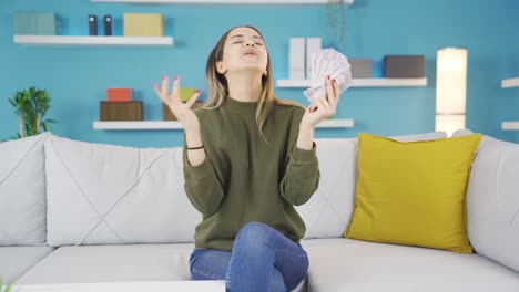 happy young girl counting money and getting happy.