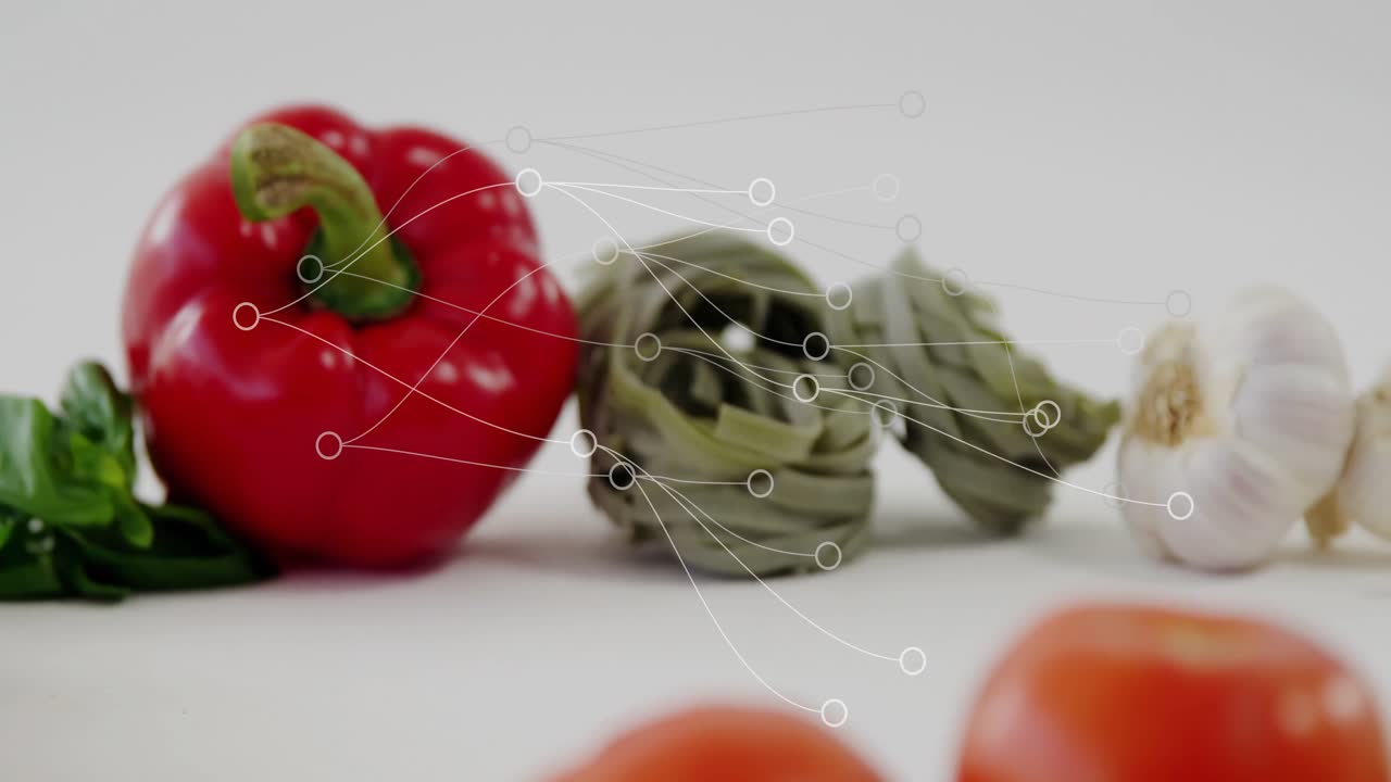 Design plano mostrando tomate vermelho maduro em bancada, com espirais de massa de espinafre e linhas de rede.