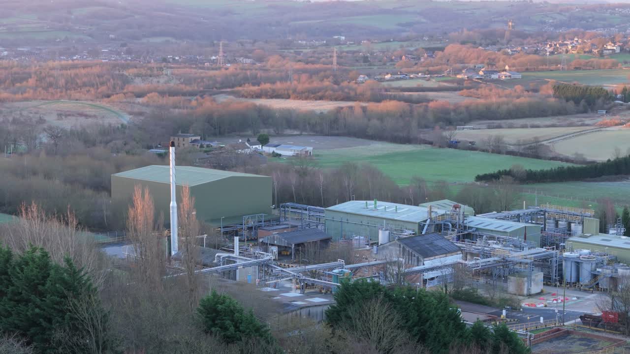 Aerial video footage of industrial buildings and housing