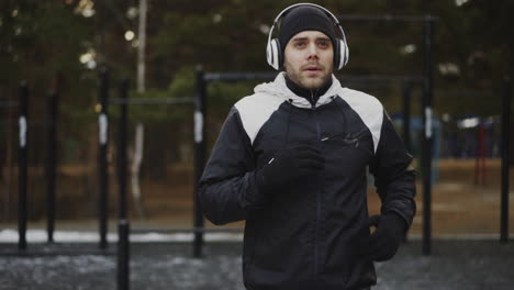 man running in park in winter
