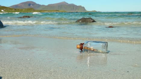 message in the bottle against the sun setting down