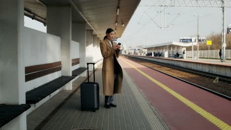 woman waiting at train station