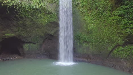 aerial view of waterfall deep in a jungle wilderness of bali, island, indonesia