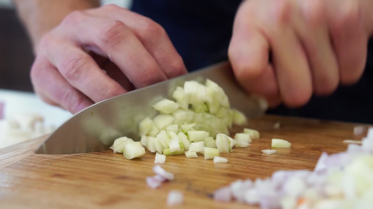 Finely dicing bulb of fennel into pieces