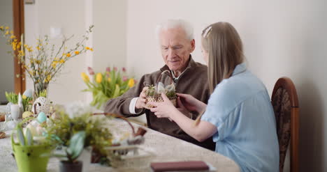 happy easter young woman give easter gift to grandfather 2