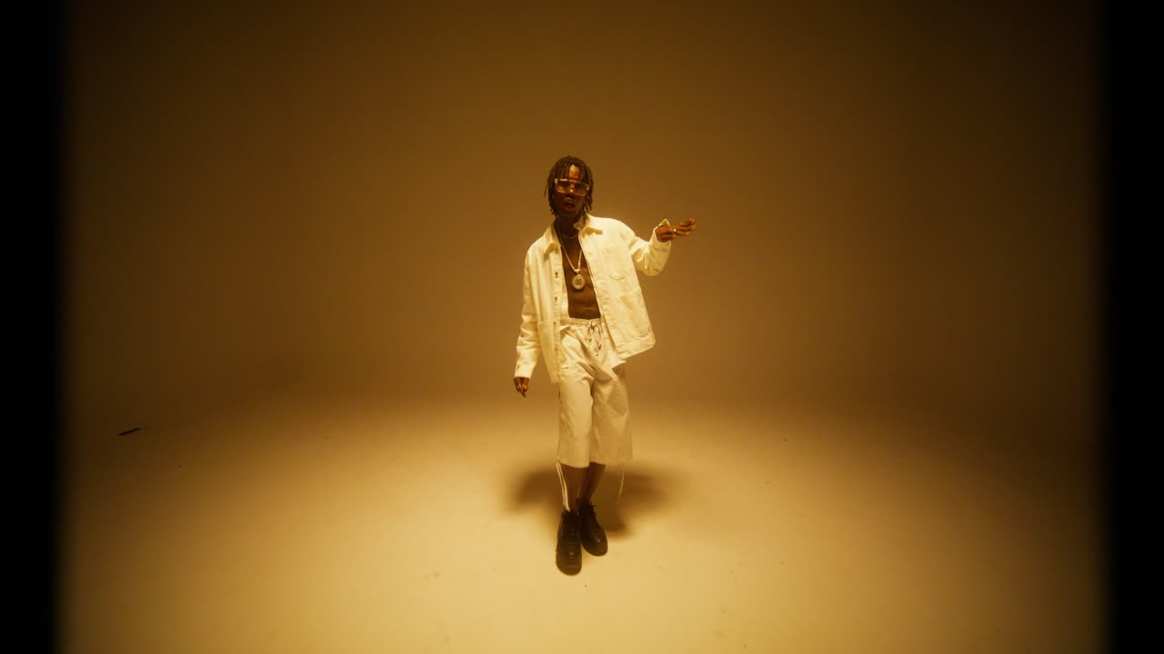 Stylish Man Dancing in a Studio with Money