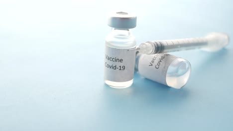 covid-19 vaccine vials and syringe