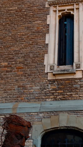 old brick castle with thin windows. low angle view on the beautiful old-fashioned building. vertical video