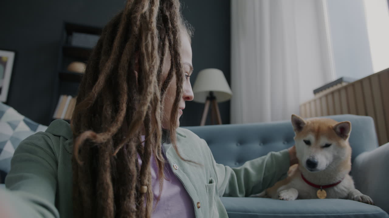 Woman and her dog in a video call