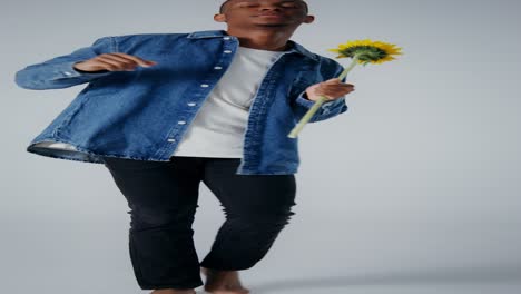 man dancing with a sunflower