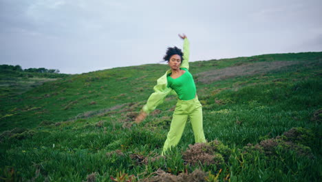 inspired woman dancing nature. african american girl performing dance vertical