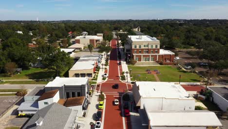 Bird's-eye-view-above-cars-driving-along-historic-downtown-Clermont-Florida-main-street